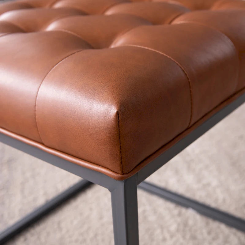 Mini pouf capitonné marron selle avec base en métal graphite