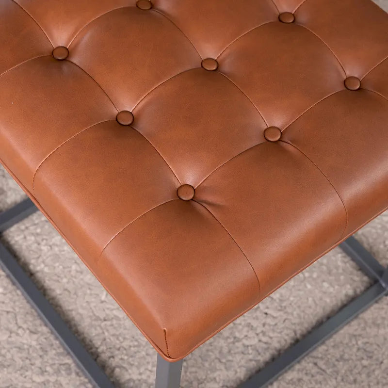 Mini pouf capitonné marron selle avec base en métal graphite
